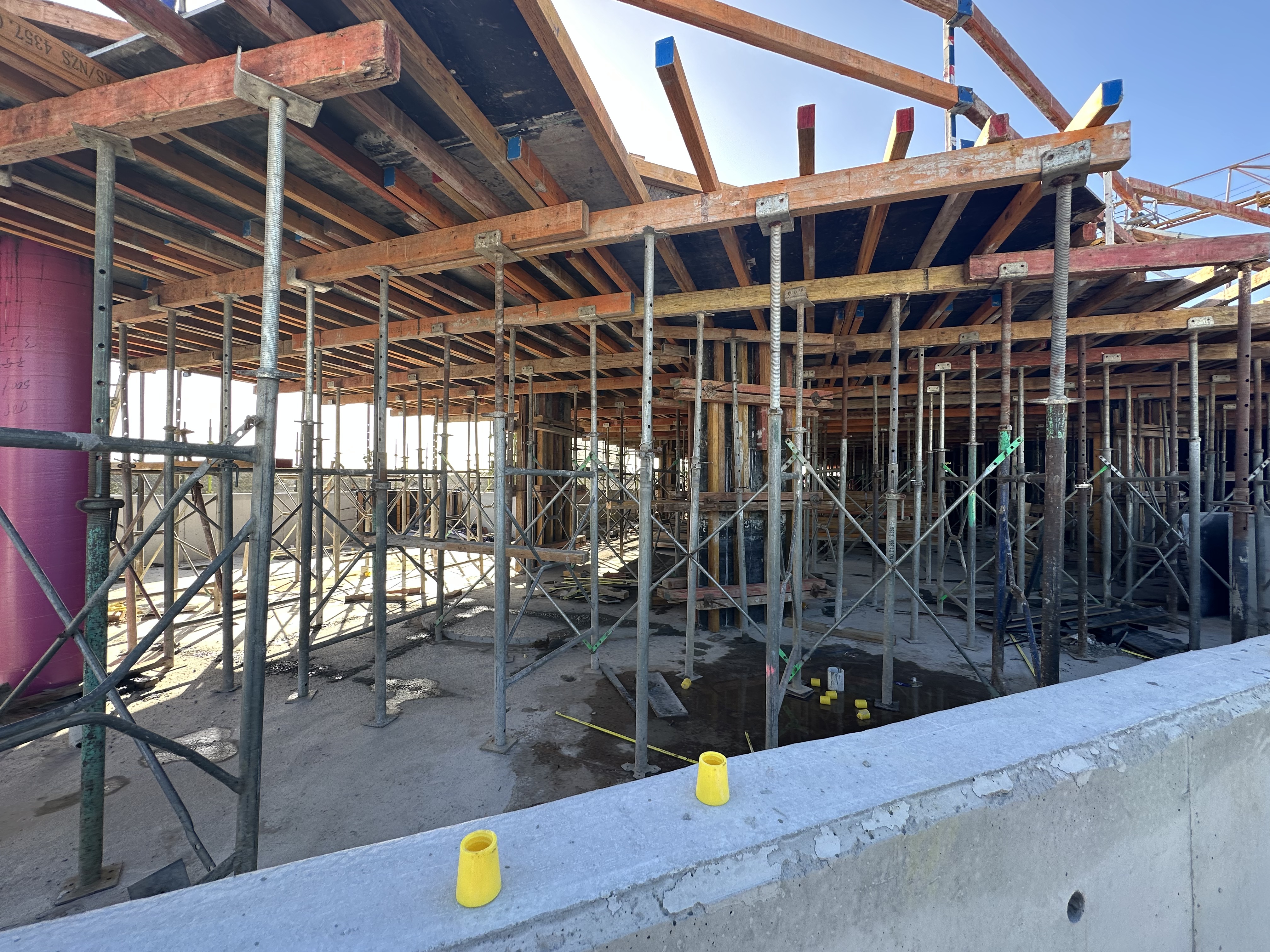 Timber formwork and steel propping during construction